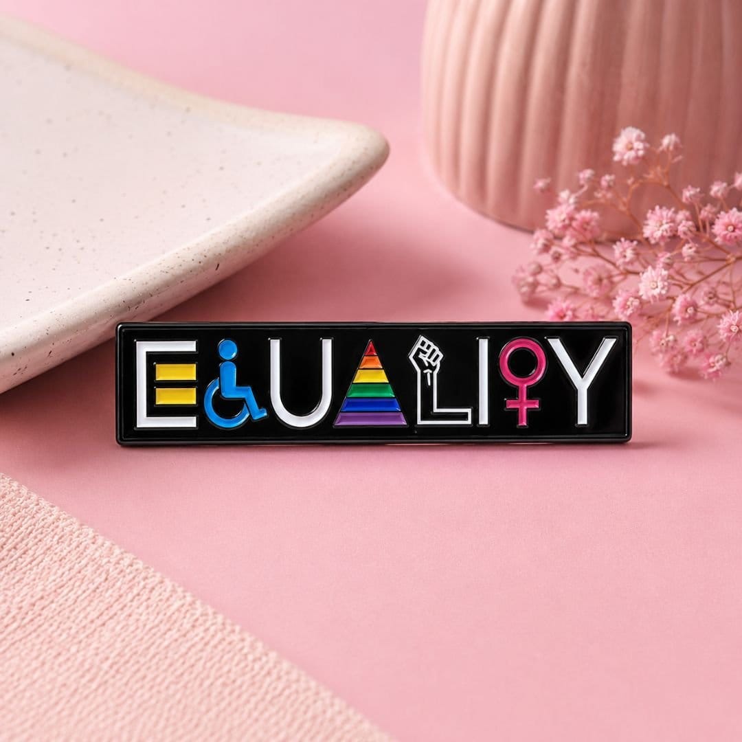 Equality enamel pin pink flat lay lifestyle with ceramic vase and dried flowers pride gift