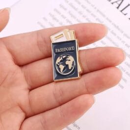 Passport enamel pin with navy cover gold globe and boarding pass cute travel lapel pin held in hand