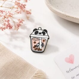 Panda boba tea enamel pin with pink strawberry bubble tea and panda face lid on white background