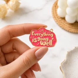 Everything Is Going Well motivational pink enamel pin with gold finish for backpacks jackets caps and tote bags