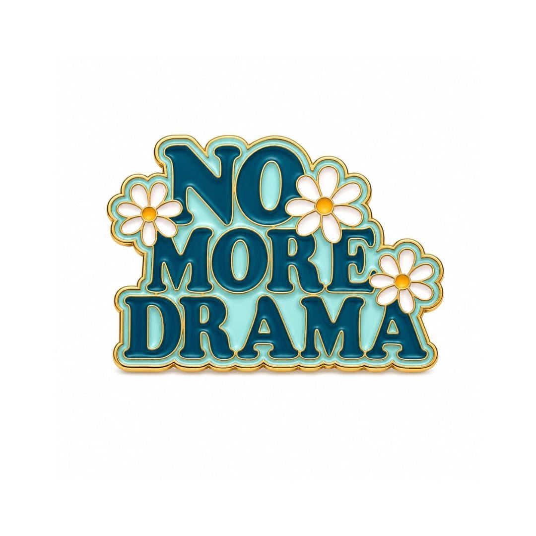 No More Drama enamel pin with floral daisy design attached to denim jeans pocket