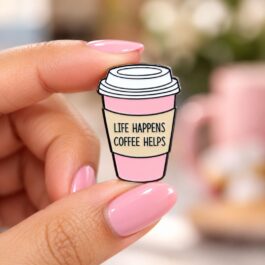 Pink takeaway coffee-cup enamel pin with Life Happens Coffee Helps quote