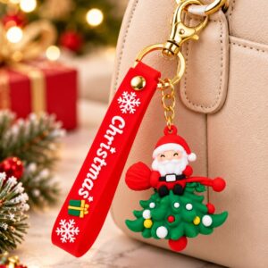 Santa sitting on a green Christmas tree 3D keychain with red silicone wrist strap perfect for secret santa